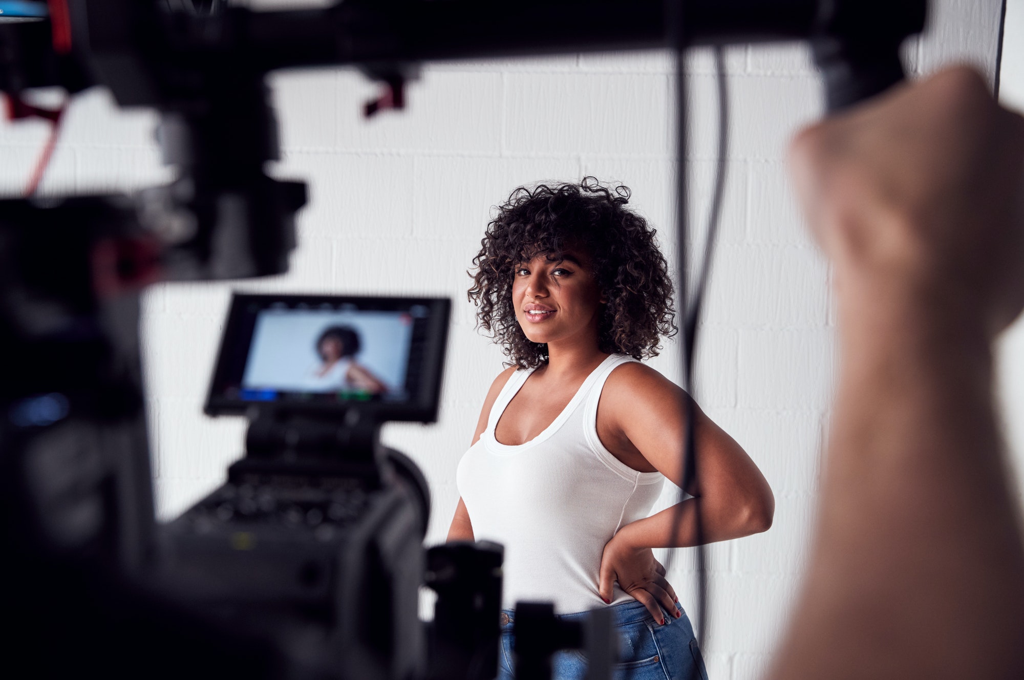 Female Model Posing For Video Camera On Film Set The 1 Studios